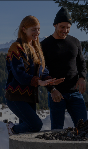 Men and women around an outdoor firepit