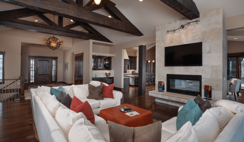 living room with white couch, fireplace, and television