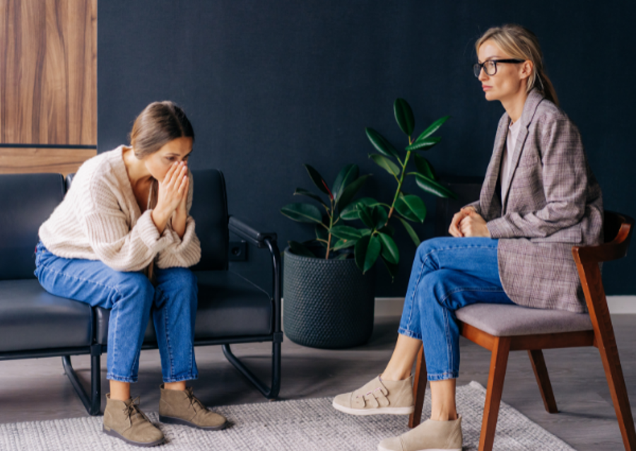 distraught young woman in trauma therapy