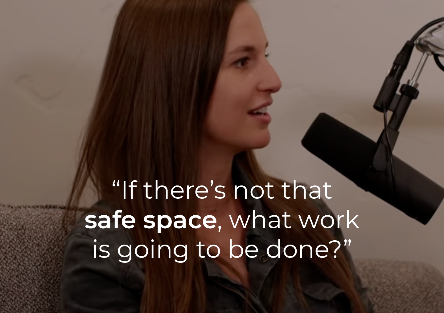 Laura Tucker speaking into a podcast microphone with a text overlay: