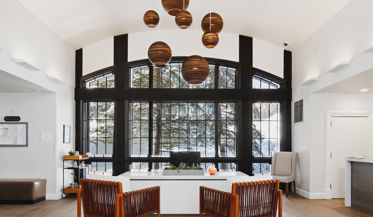 APN Entryway with tall windows, desk, and chairs