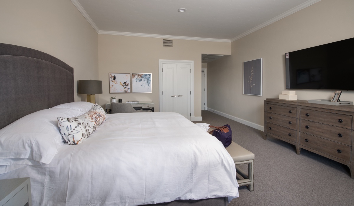 Bed and television in front of doorway