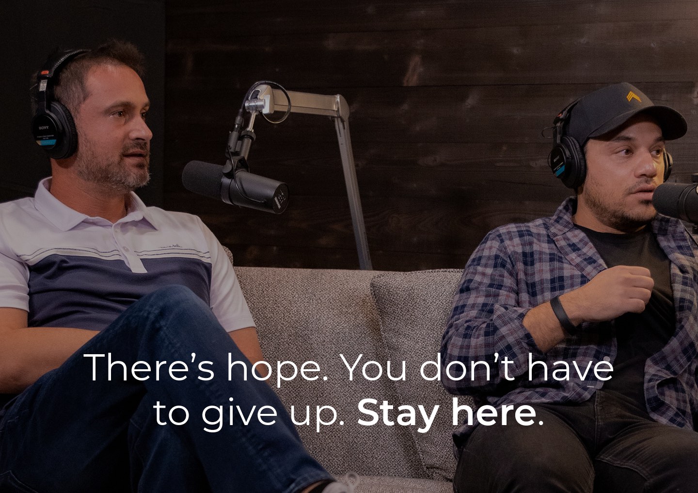 Andy and Dave sitting on a couch listening to the podcast guest with a text overlay that says There is hope. You don't have to give up. Stay here.