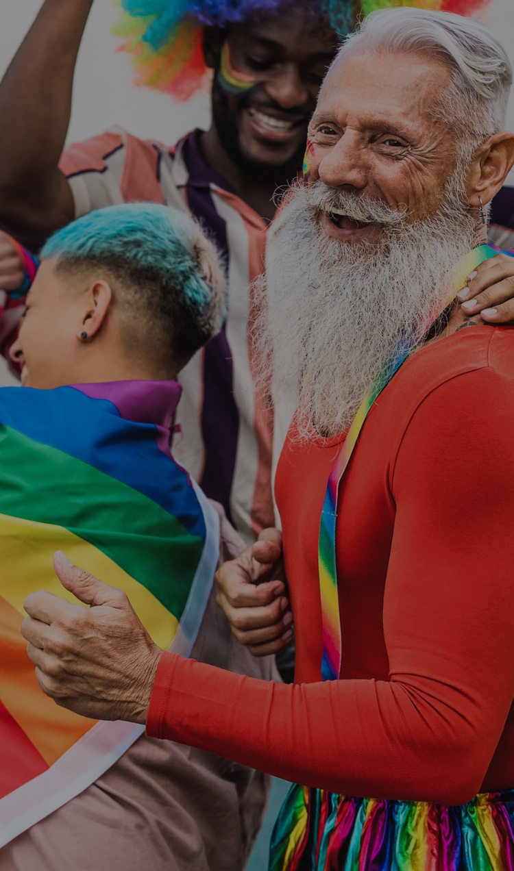 A crowd of people celebrating at a Pride event.