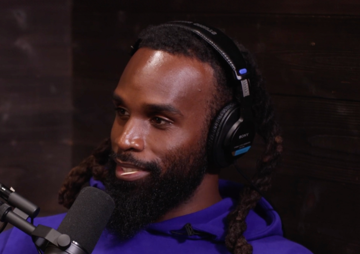 Soul Cole talks into a microphone on the Tackling Stigma podcast miniseries.