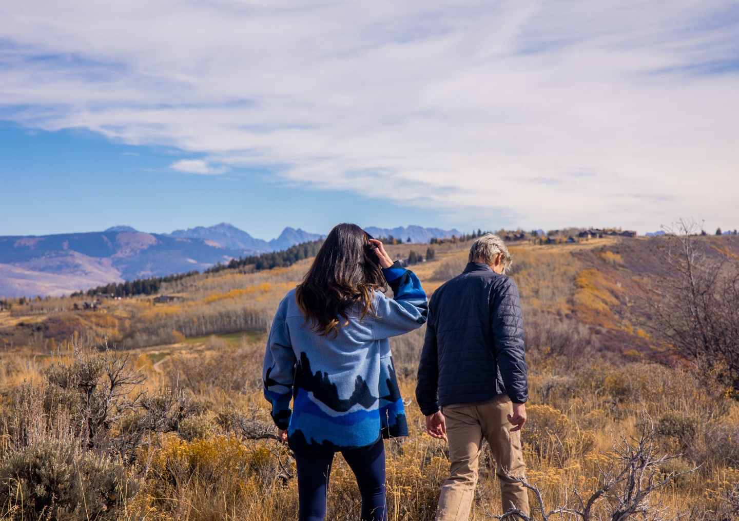 Two clients hike through the terrain near All Points North Lodge in Edwards, Colorado.