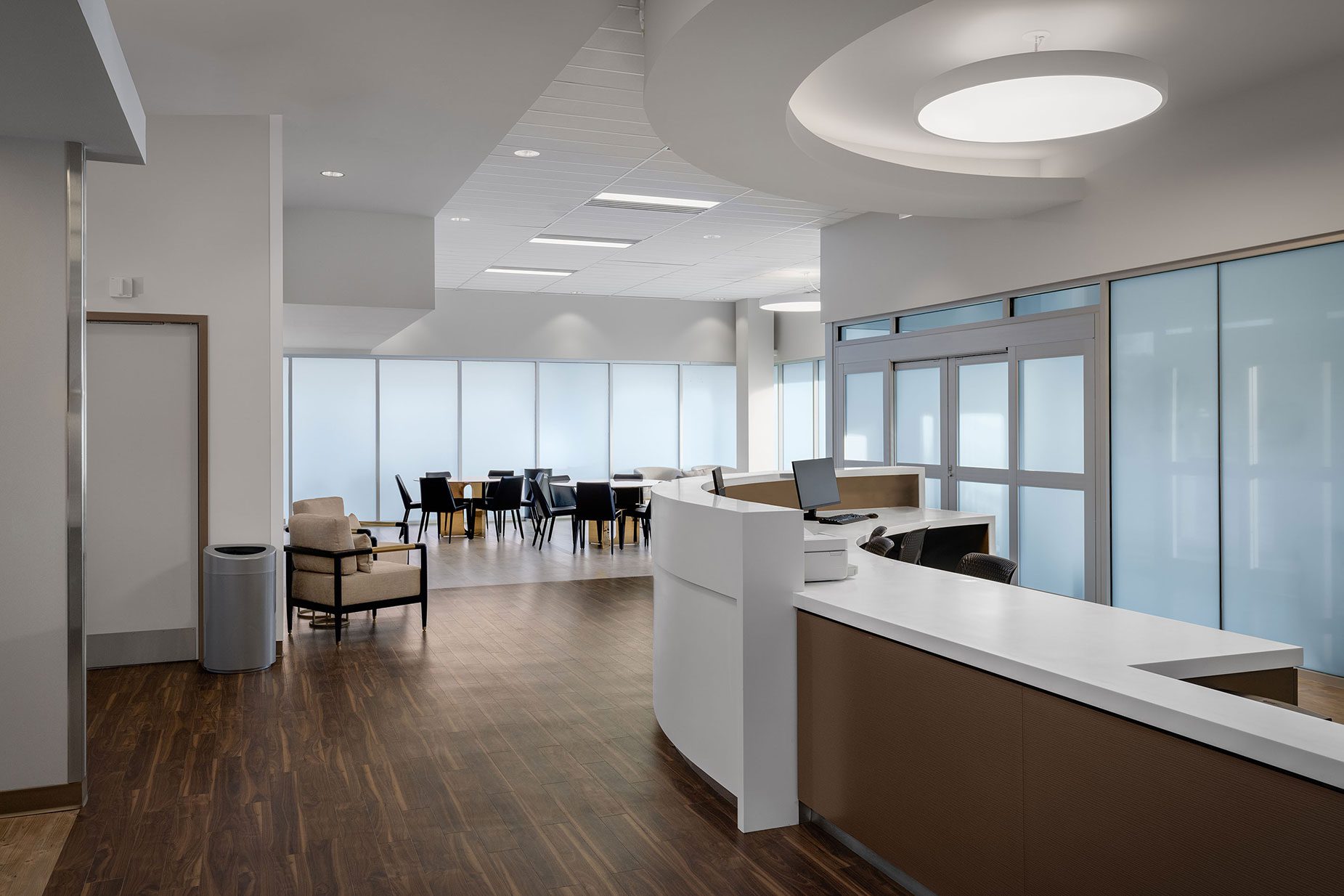 Modern treatment center interior featuring a reception area, comfortable seating, and a dining space, emphasizing luxury and personalized care for addiction recovery.