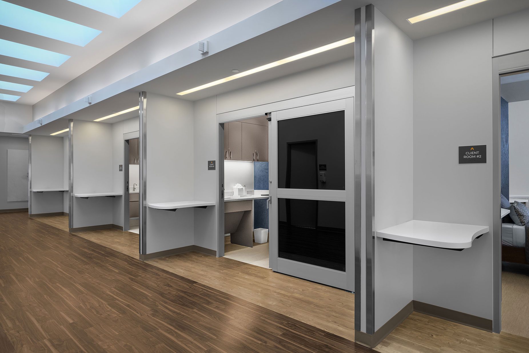 Modern client room corridor at All Points North Denver, featuring sleek design, luxury amenities, and accessible treatment spaces for personalized addiction recovery.