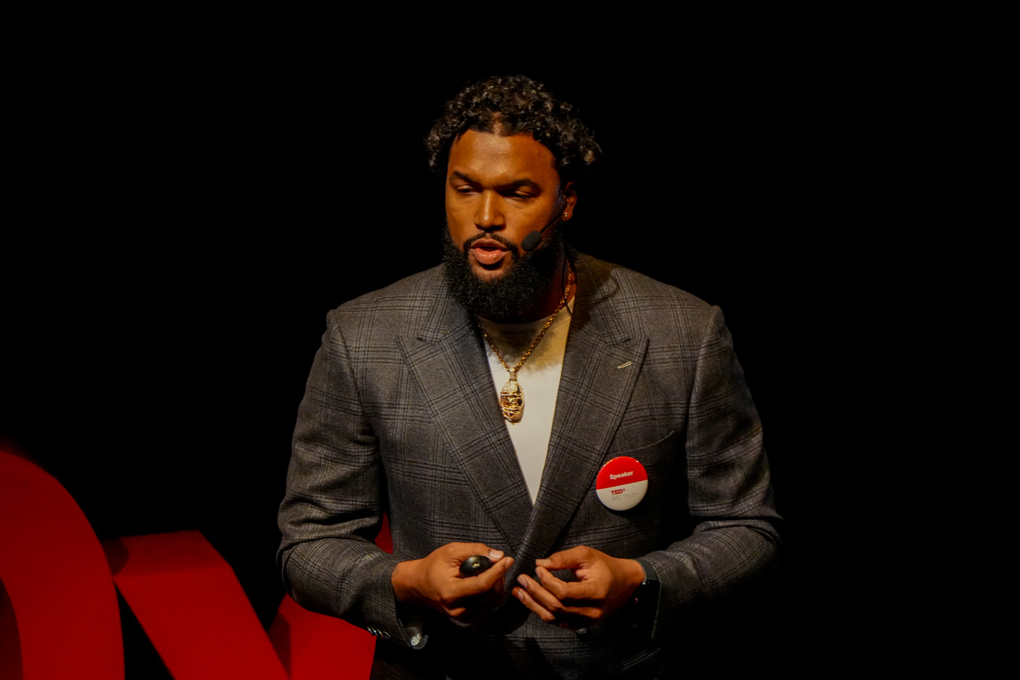 Marcus Smith II delivers his TEDx talk on stage.